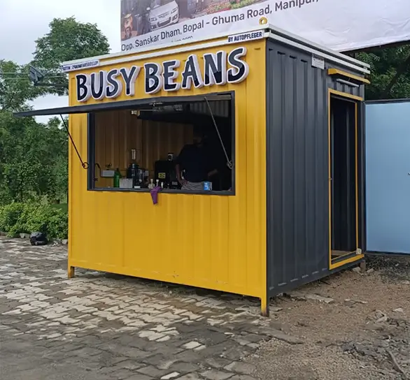 MS Porta Cabin with a neem tree in the background at an Indian construction site.